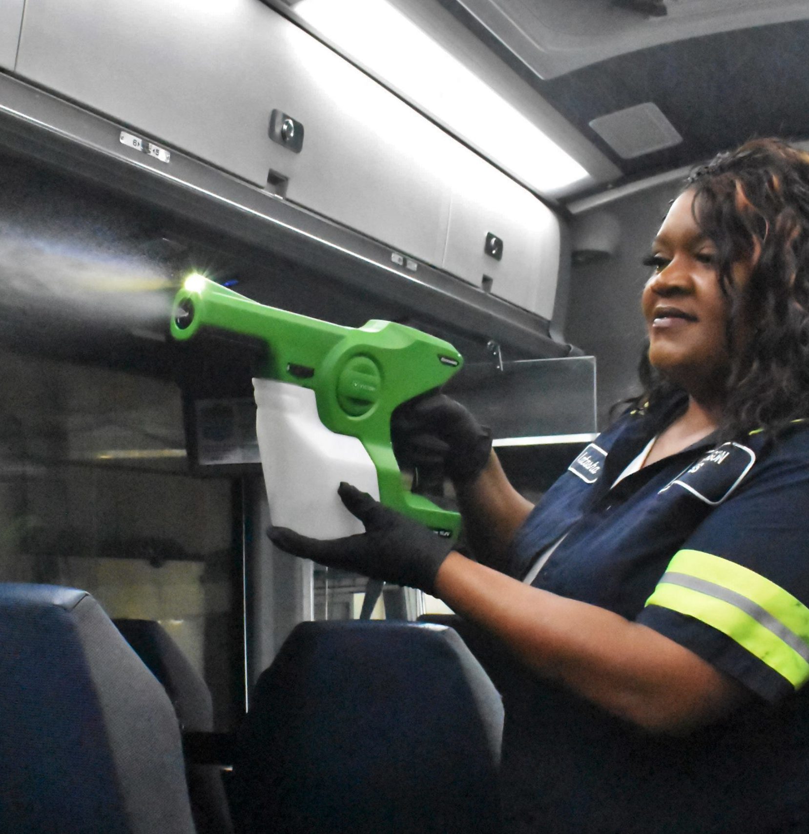 Jefferson Lines detailer uses electrostatic sprayer to disinfect bus interior