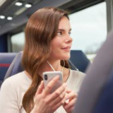 Passenger using Jefferson Lines free Passenger Wi-Fi